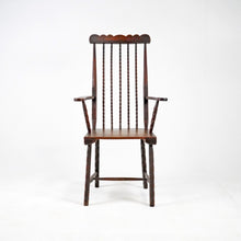 Early 19th Century English Elm Folk Art Comb Back Windsor Chair.
